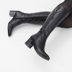 Bottes à talons en cuir noir femme