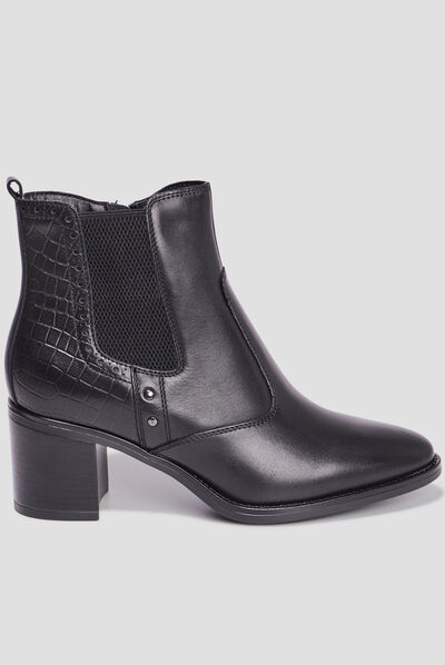 Bottines à talons avec clous en cuir noir femme