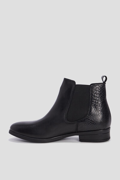 Bottines chelsea plates en cuir noir femme