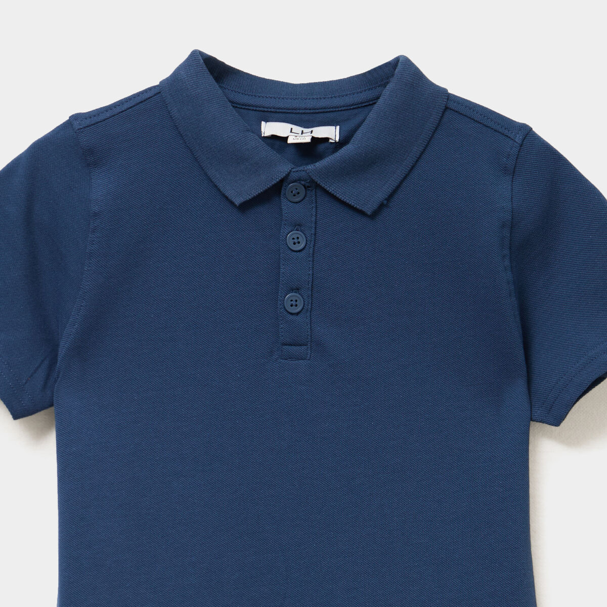 Polo manches courtes à détail brodé bleu marine garçon