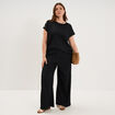 Pantalon effet gaufr&eacute; fluide noir femme grande taille