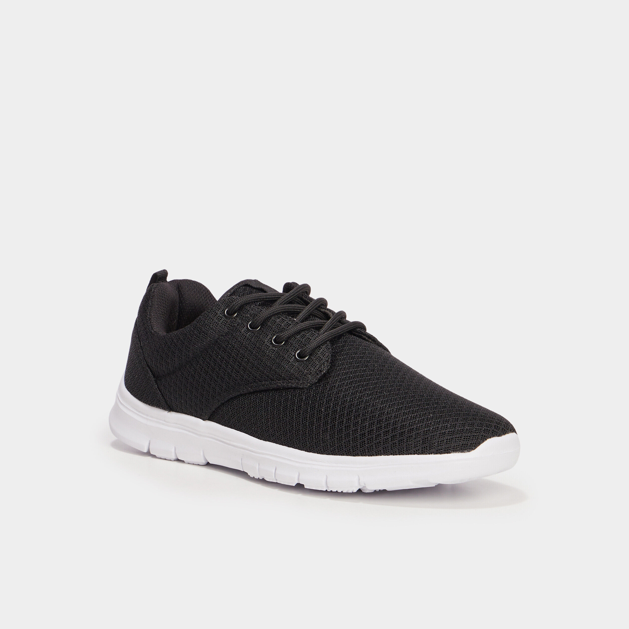 Baskets plates running crantées noir homme