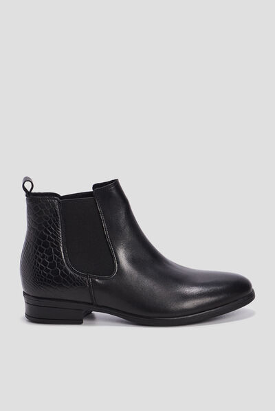 Bottines chelsea plates en cuir noir femme