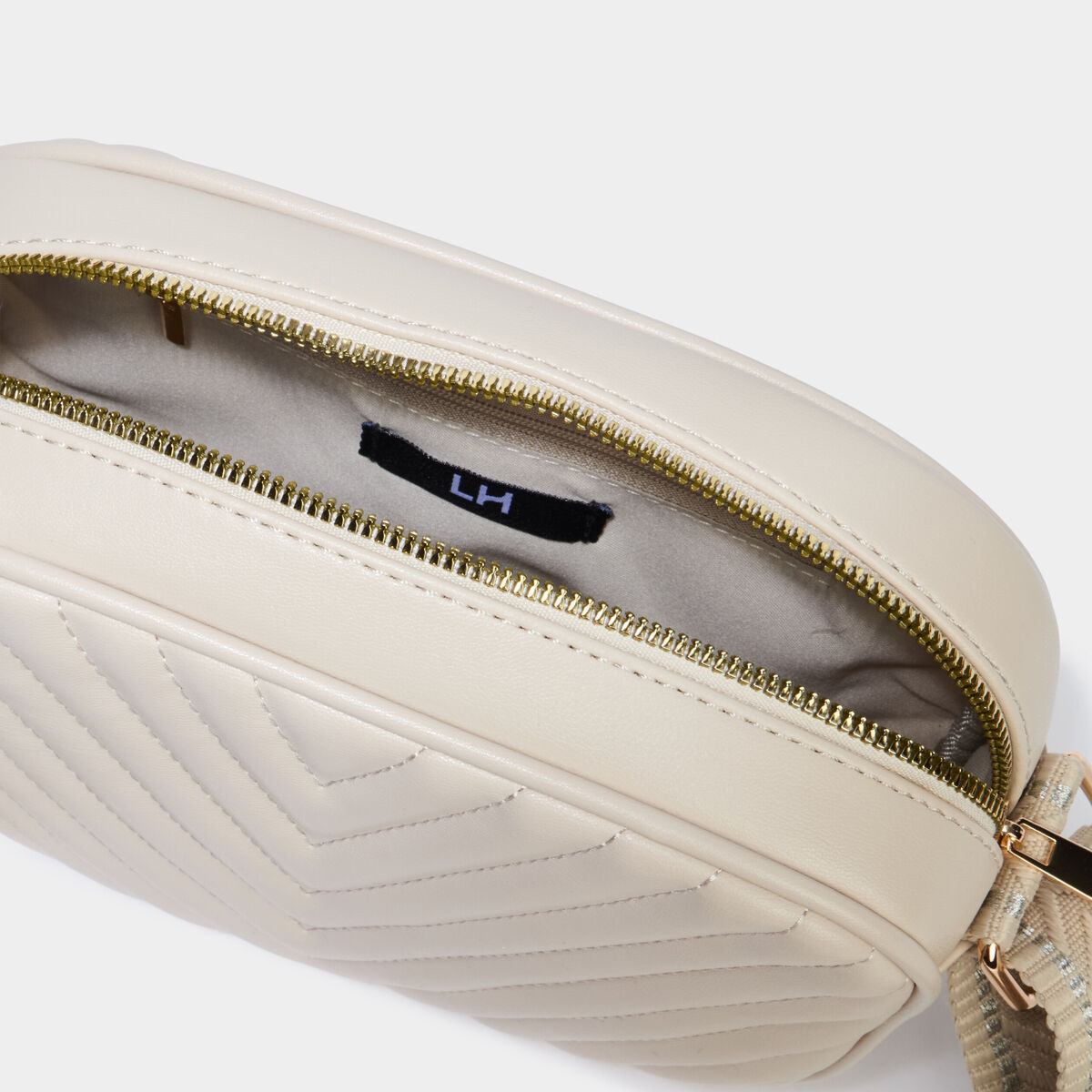 Sac bandouli&egrave;re matelass&eacute; ivoire femme