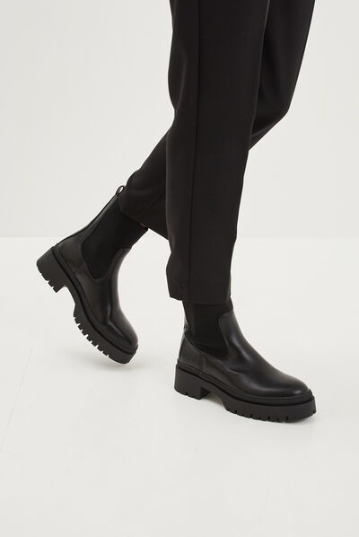 Bottines ranger crantées noir femme