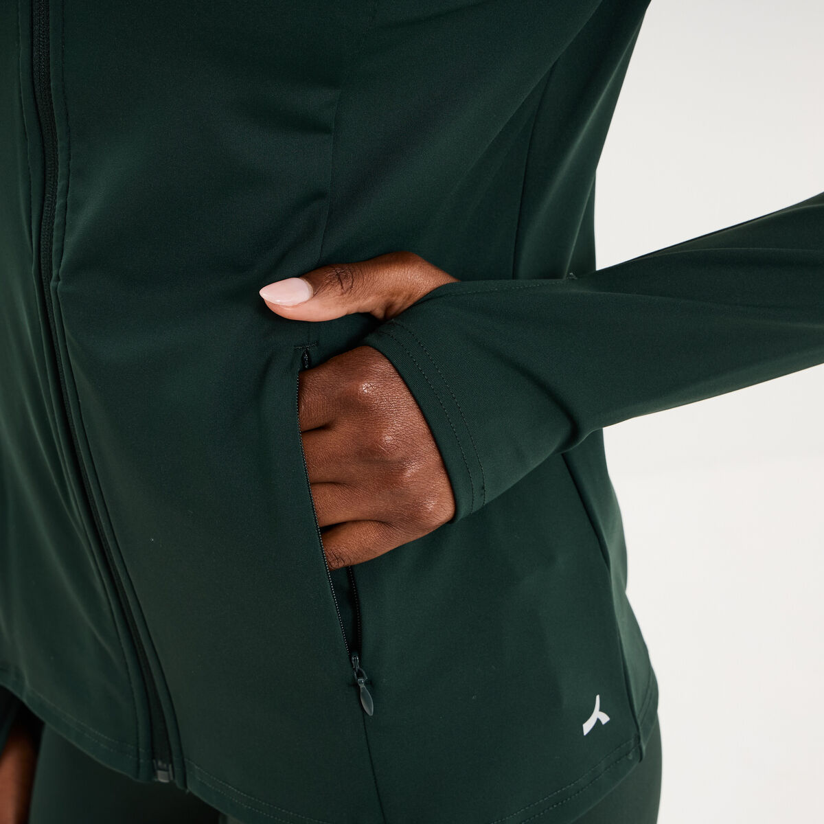 Veste de sport ajust&eacute;e avec fermeture vert fonc&eacute; femme