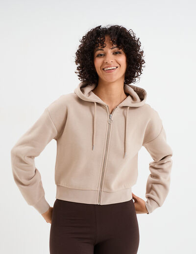 Sweat zippé à capuche court sable femme