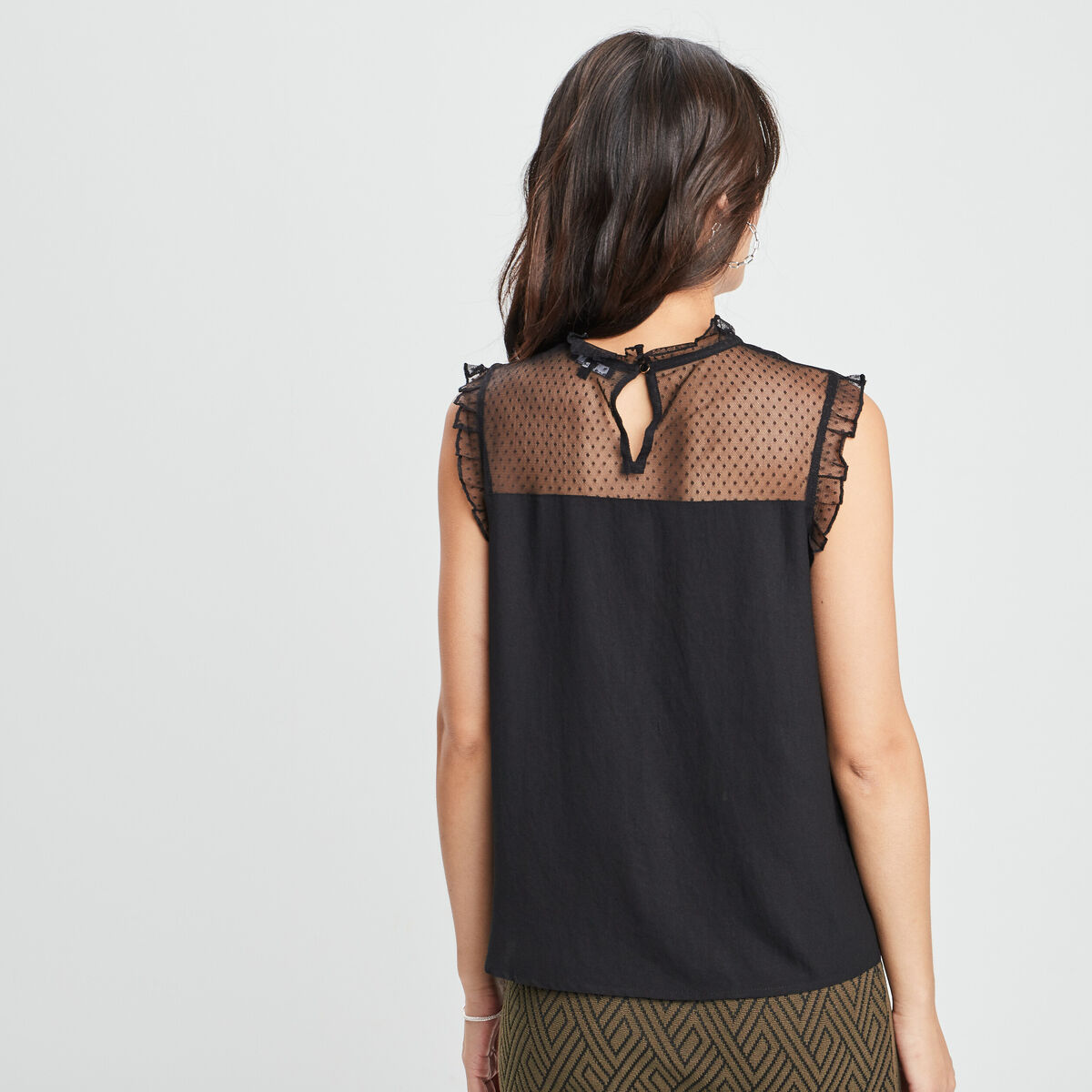 Blouse plumetis habillée sans manches noir femme