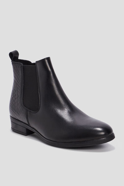 Bottines chelsea plates en cuir noir femme