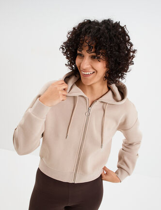 Sweat zippé à capuche court sable femme