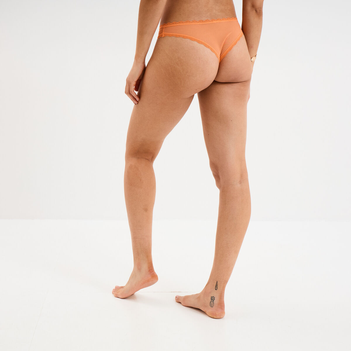 Tanga en dentelle orange femme