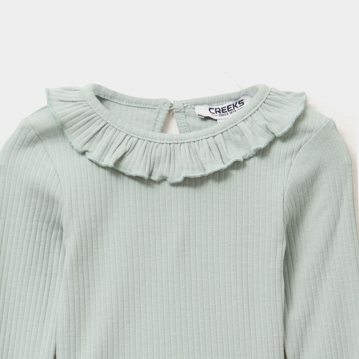 T-shirt côtelé col à volants vert pastel bébé fille