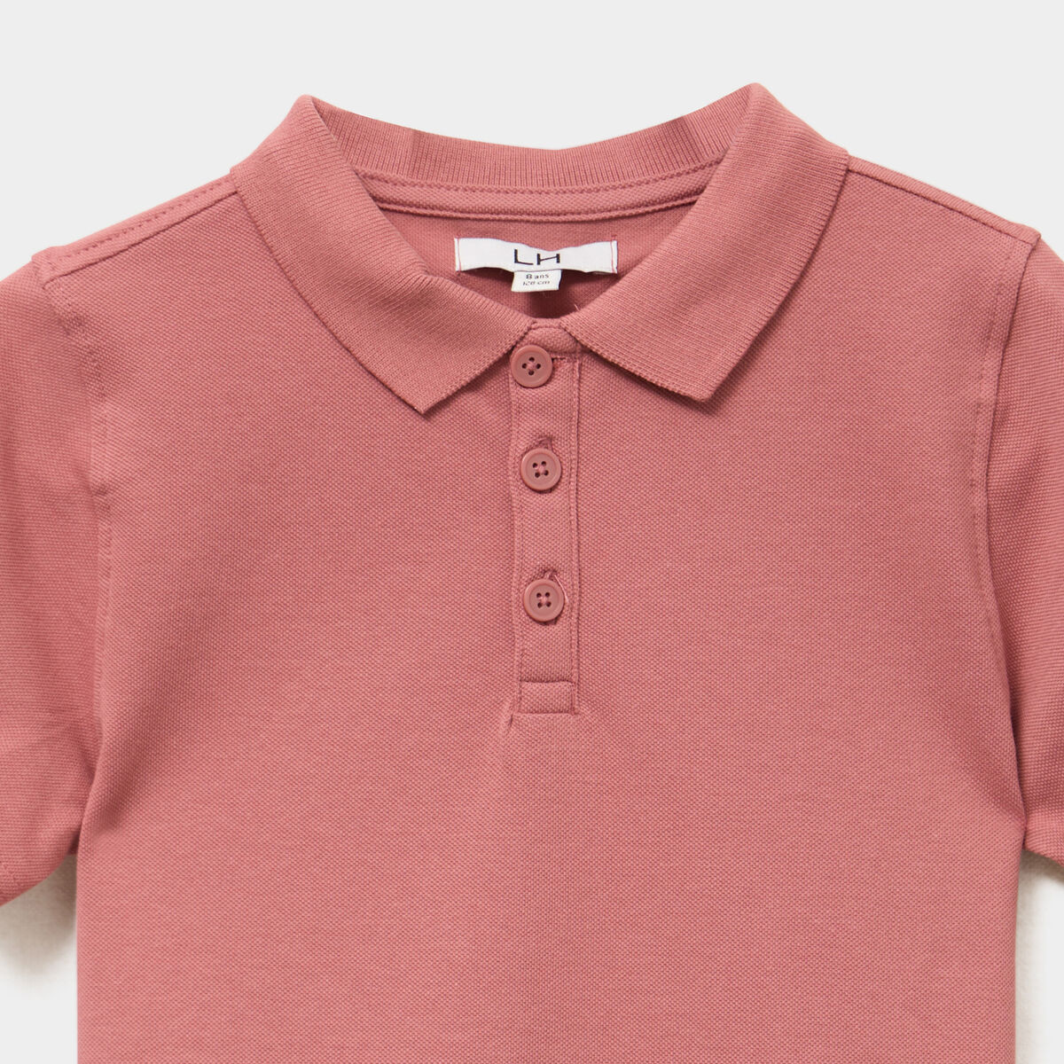 Polo manches courtes à détail brodé vieux rose garçon
