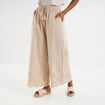 Pantalon avec broderie anglaise beige femme