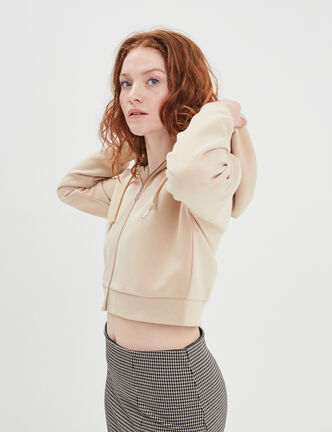 Sweat zippé à capuche court sable femme