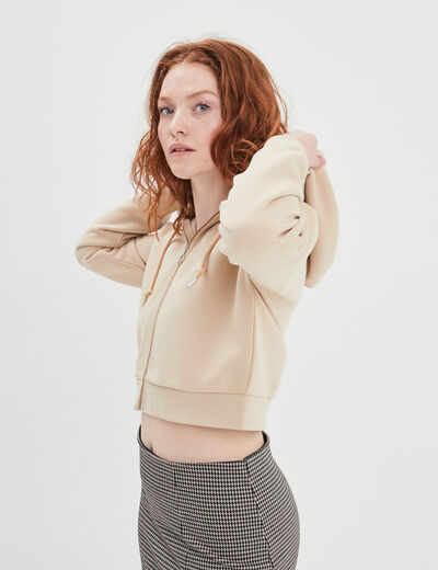 Sweat zippé à capuche court sable femme