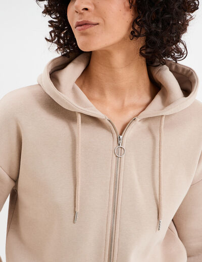 Sweat zippé à capuche court sable femme