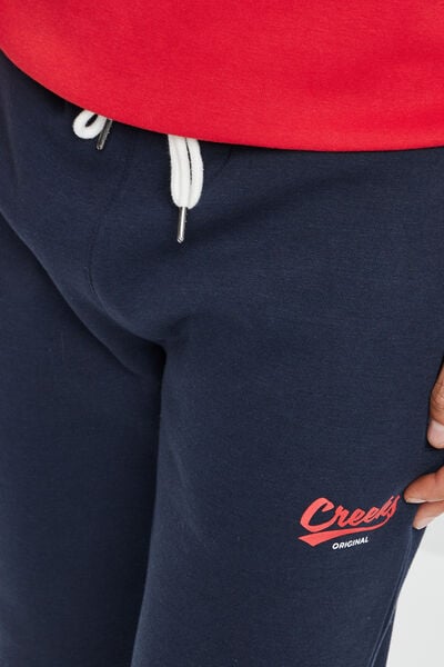 Pantalon jogging ajust&eacute; bleu marine homme