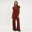 Pantalon effet gaufr&eacute; fluide bordeaux femme