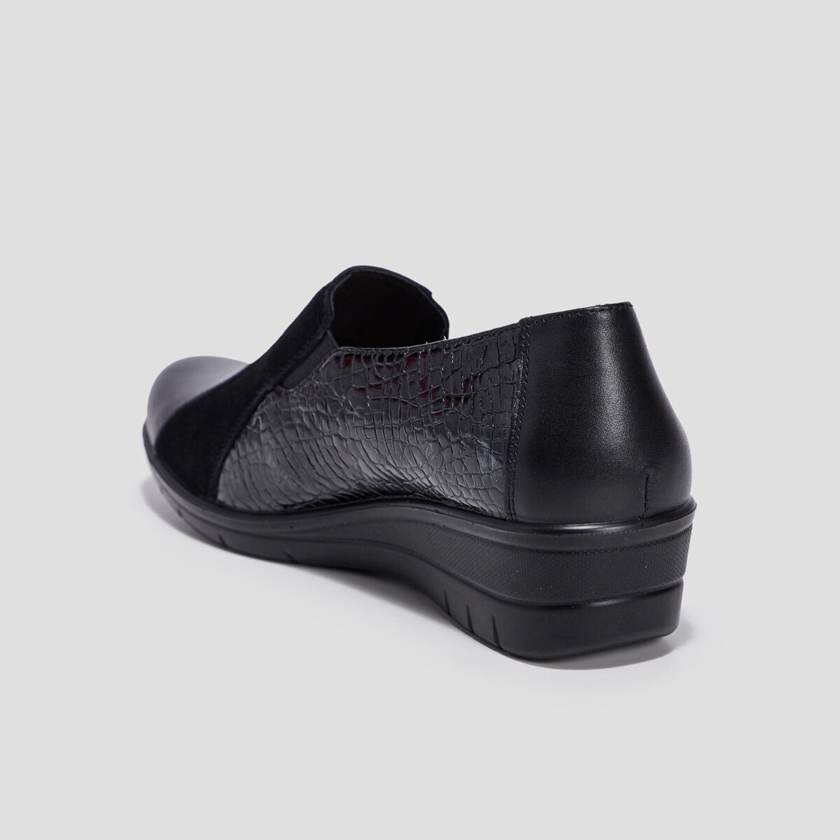 Loafers compensés en cuir noir femme