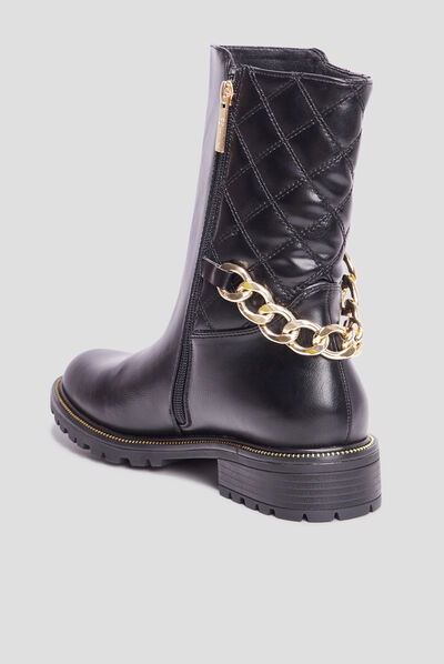 Bottes matelassées avec chaînes noir femme