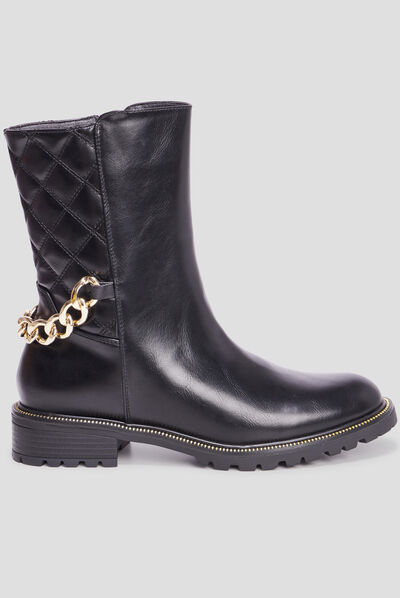 Bottes matelassées avec chaînes noir femme
