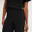 Pantalon large gaufr&eacute; taille &eacute;lastiqu&eacute;e noir femme