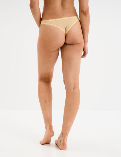 Tanga en dentelle doublure coton jaune clair femme