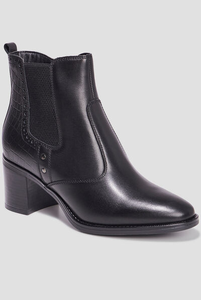 Bottines à talons avec clous en cuir noir femme