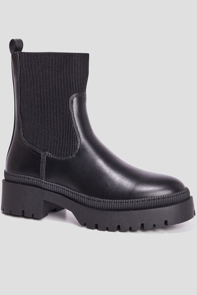 Bottines ranger crantées noir femme
