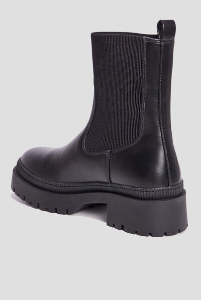 Bottines ranger crantées noir femme