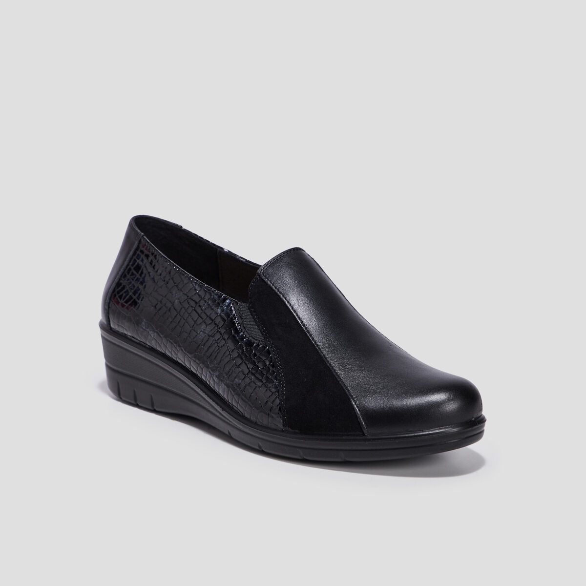 Loafers compensés en cuir noir femme