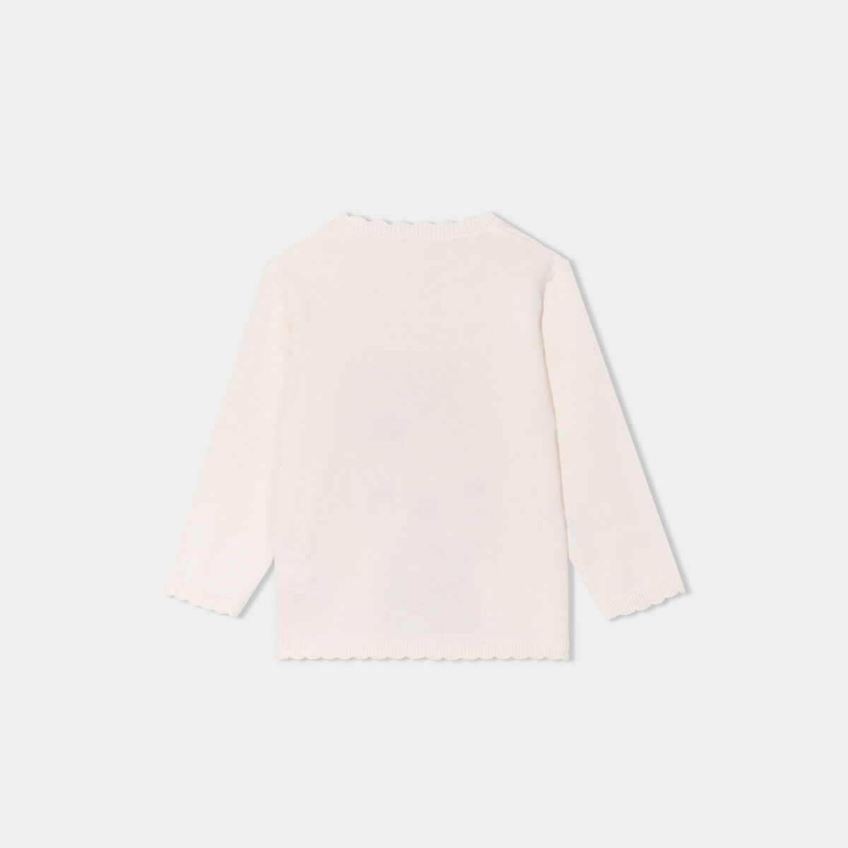 Pull manches longues bord festonné coton creme bébé fille