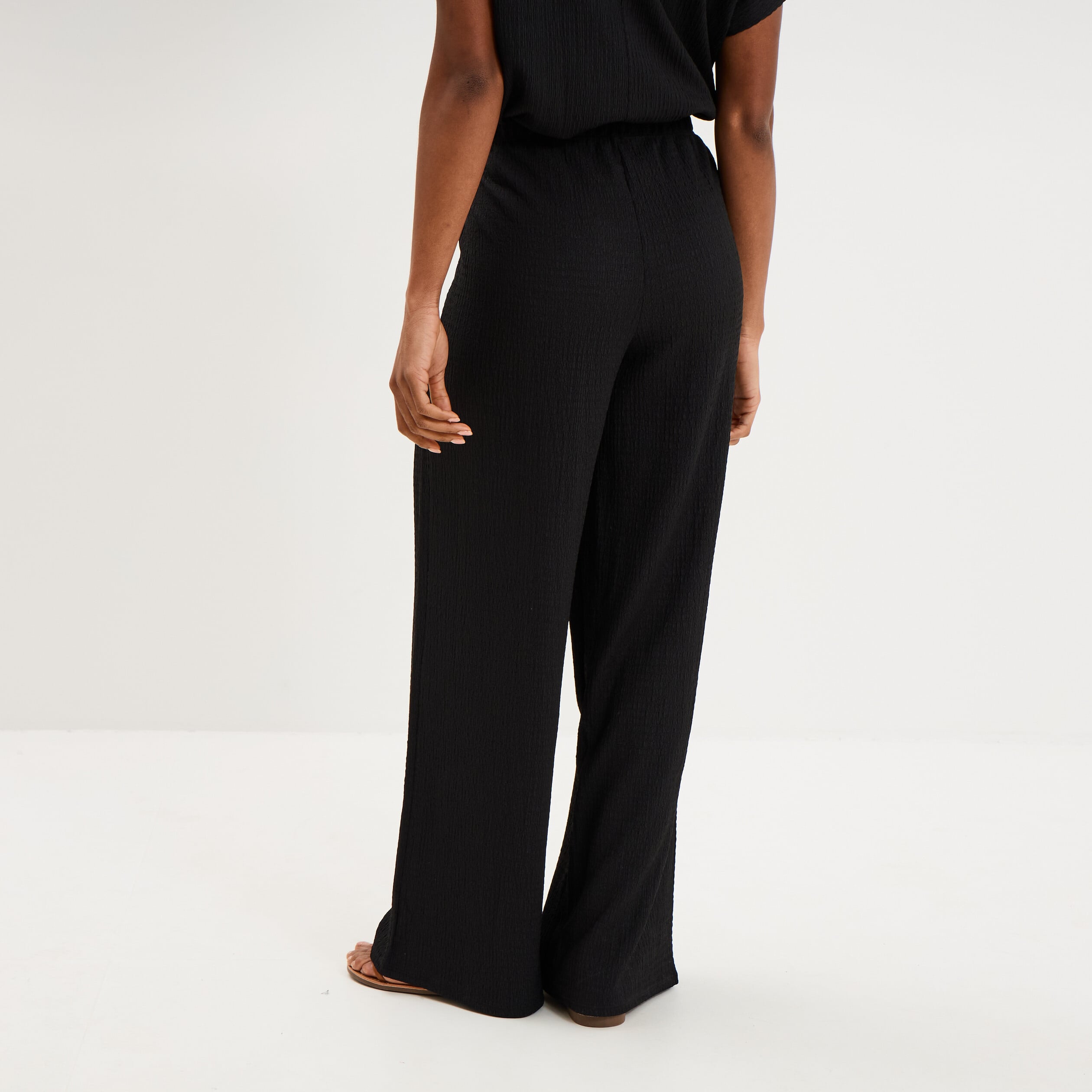 Pantalon large gaufr&eacute; taille &eacute;lastiqu&eacute;e noir femme