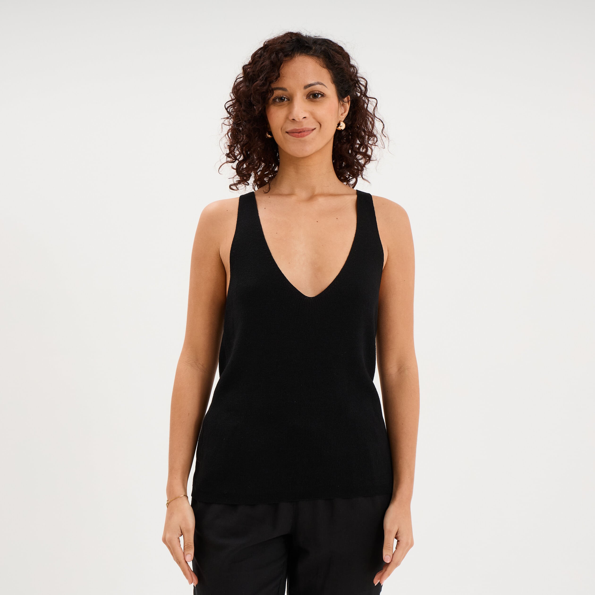D&eacute;bardeur en maille col en V noir femme