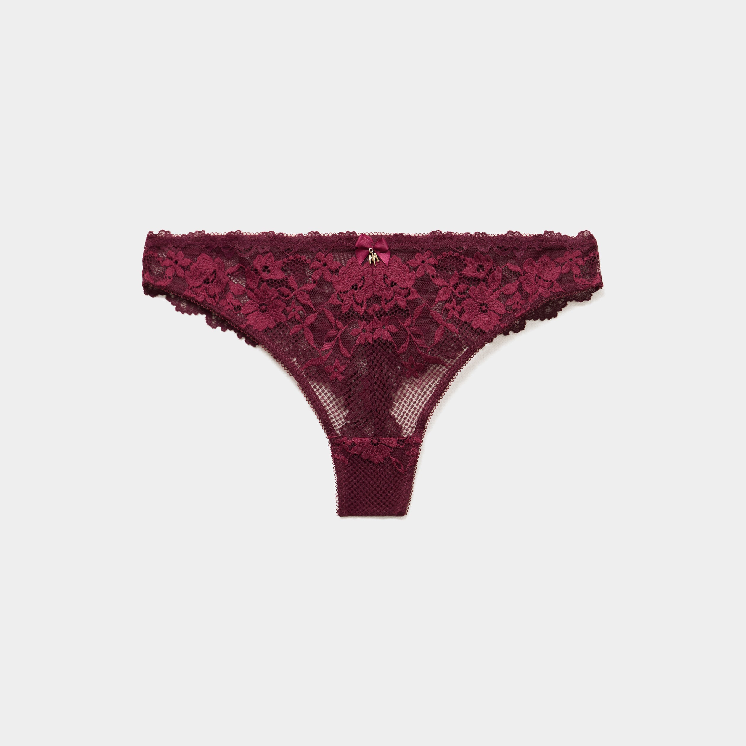 Tanga en dentelle prune femme