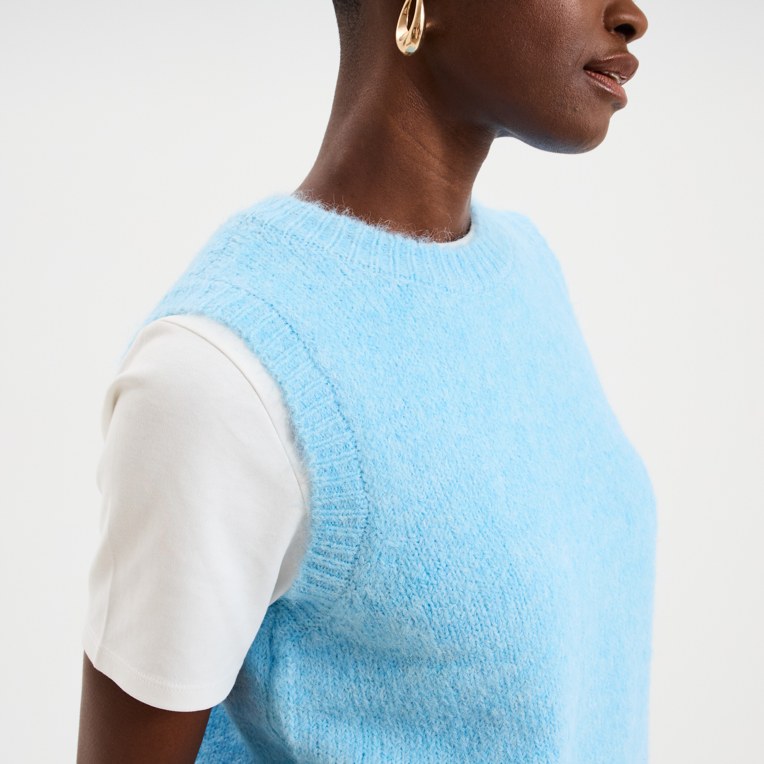 Pull sans manches col rond bleu clair femme