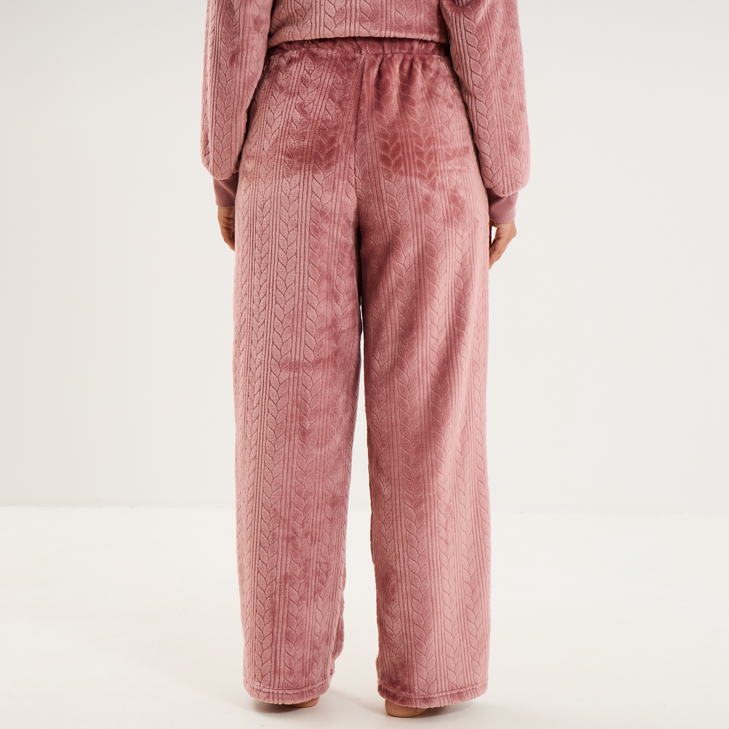 Pantalon effet polaire d&eacute;tails torsades rose framboise femme