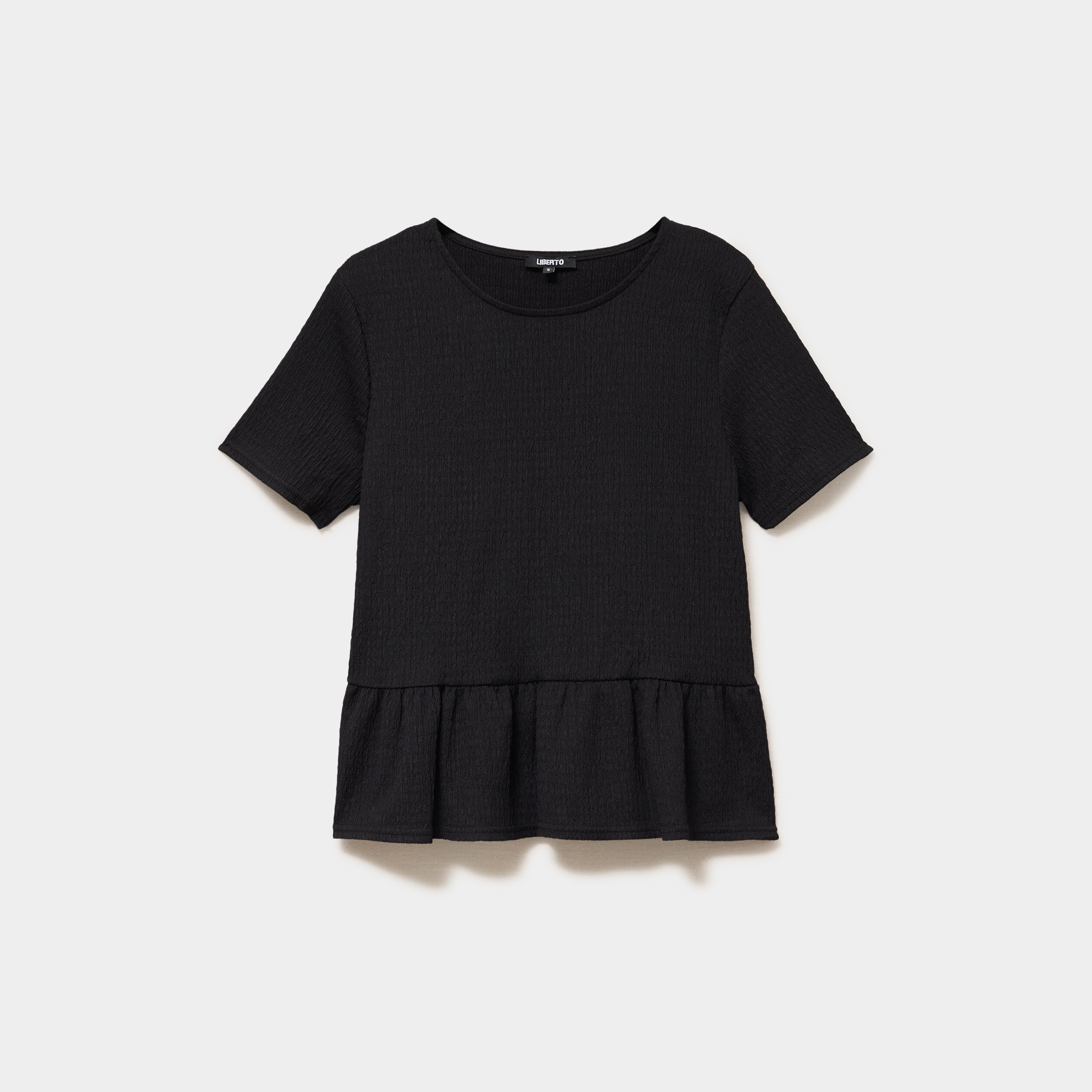 T-shirt gaufr&eacute; taille &agrave; volants noir femme