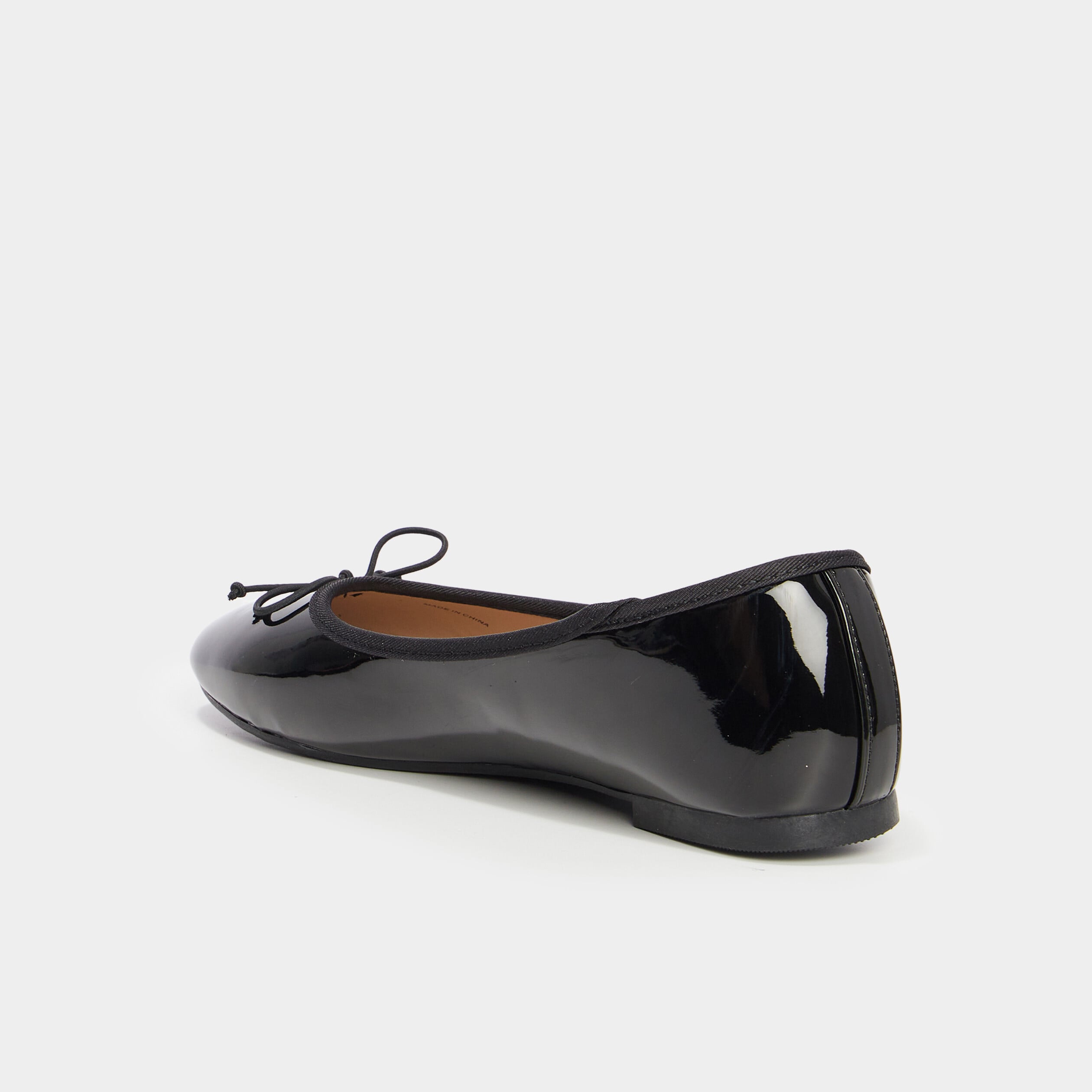 Ballerines vernies plates avec noeud noir femme