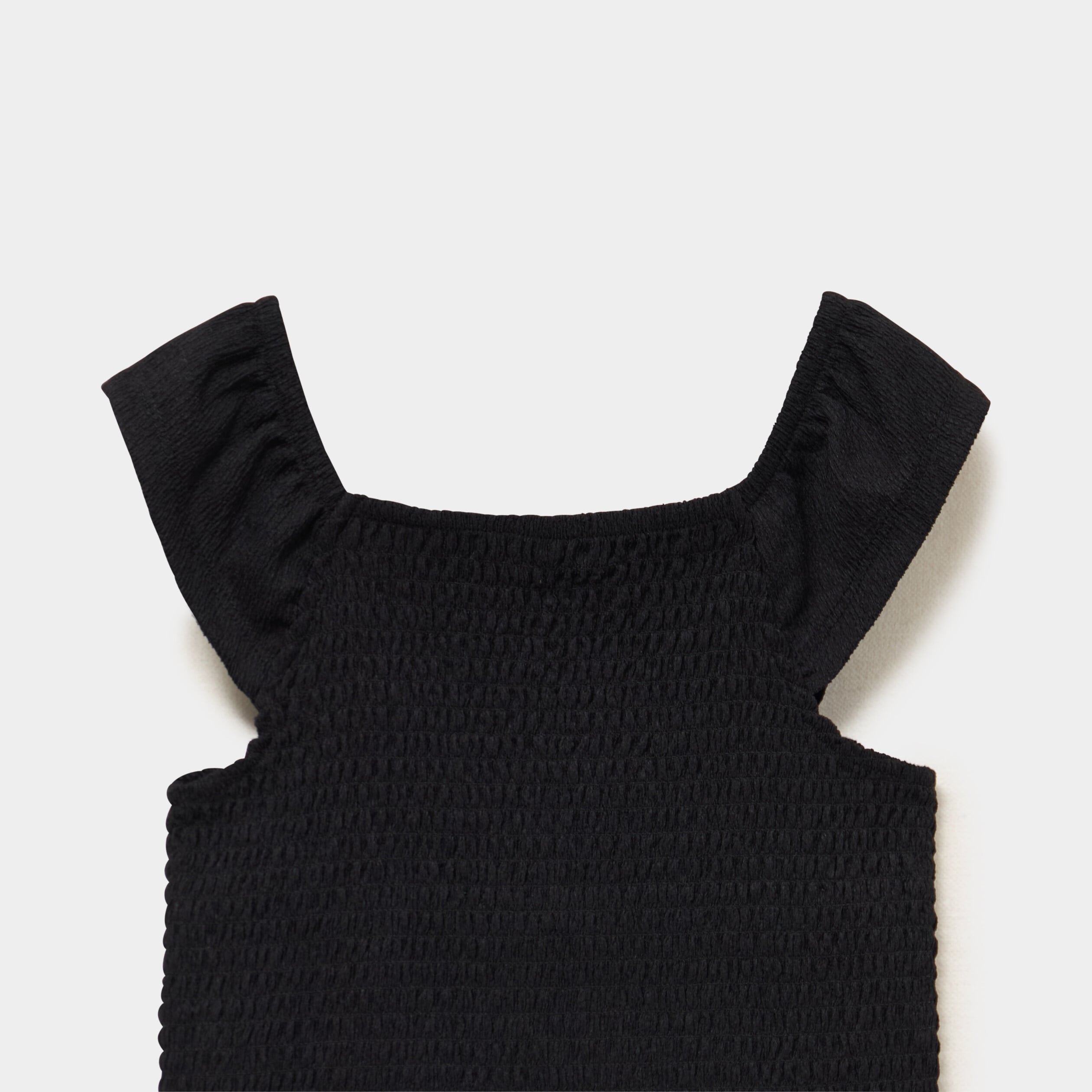 Blouse smock&eacute;e ajust&eacute;e avec volants noir fille