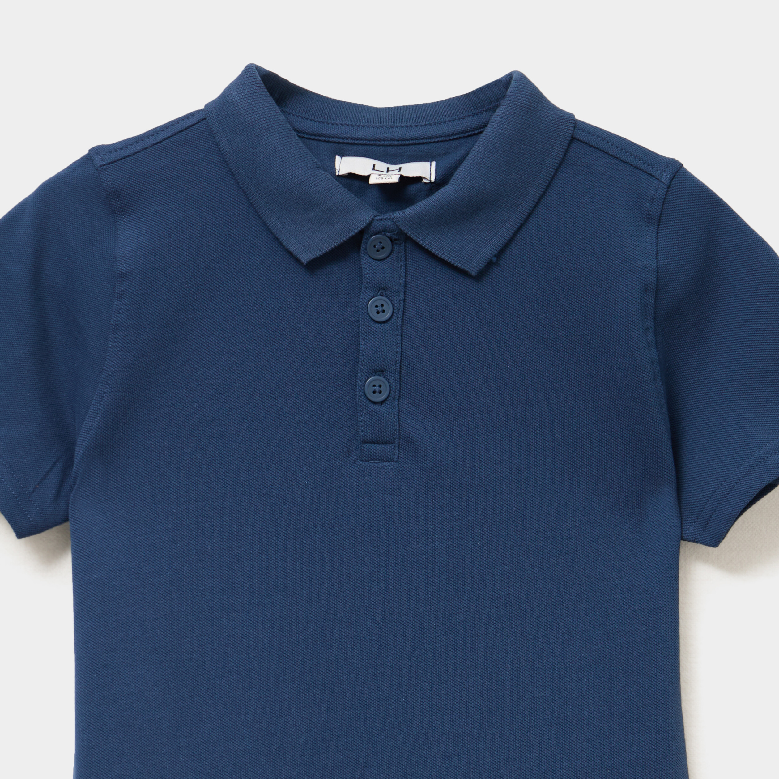 Polo manches courtes &agrave; d&eacute;tail brod&eacute; bleu marine gar&ccedil;on